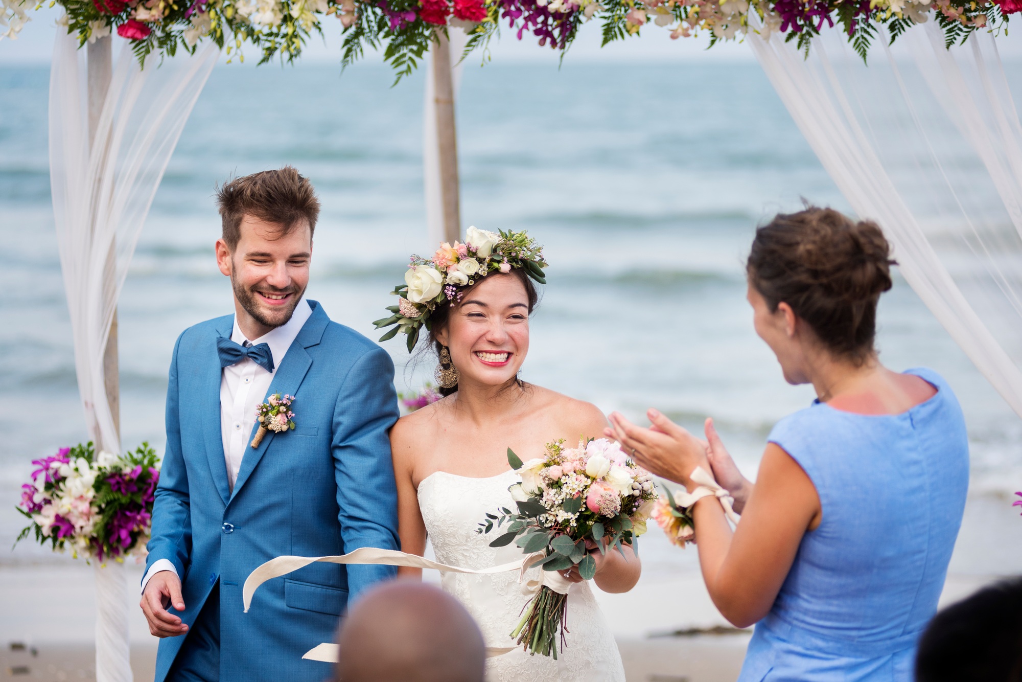 Young couple in a wedding ceremony at the beach