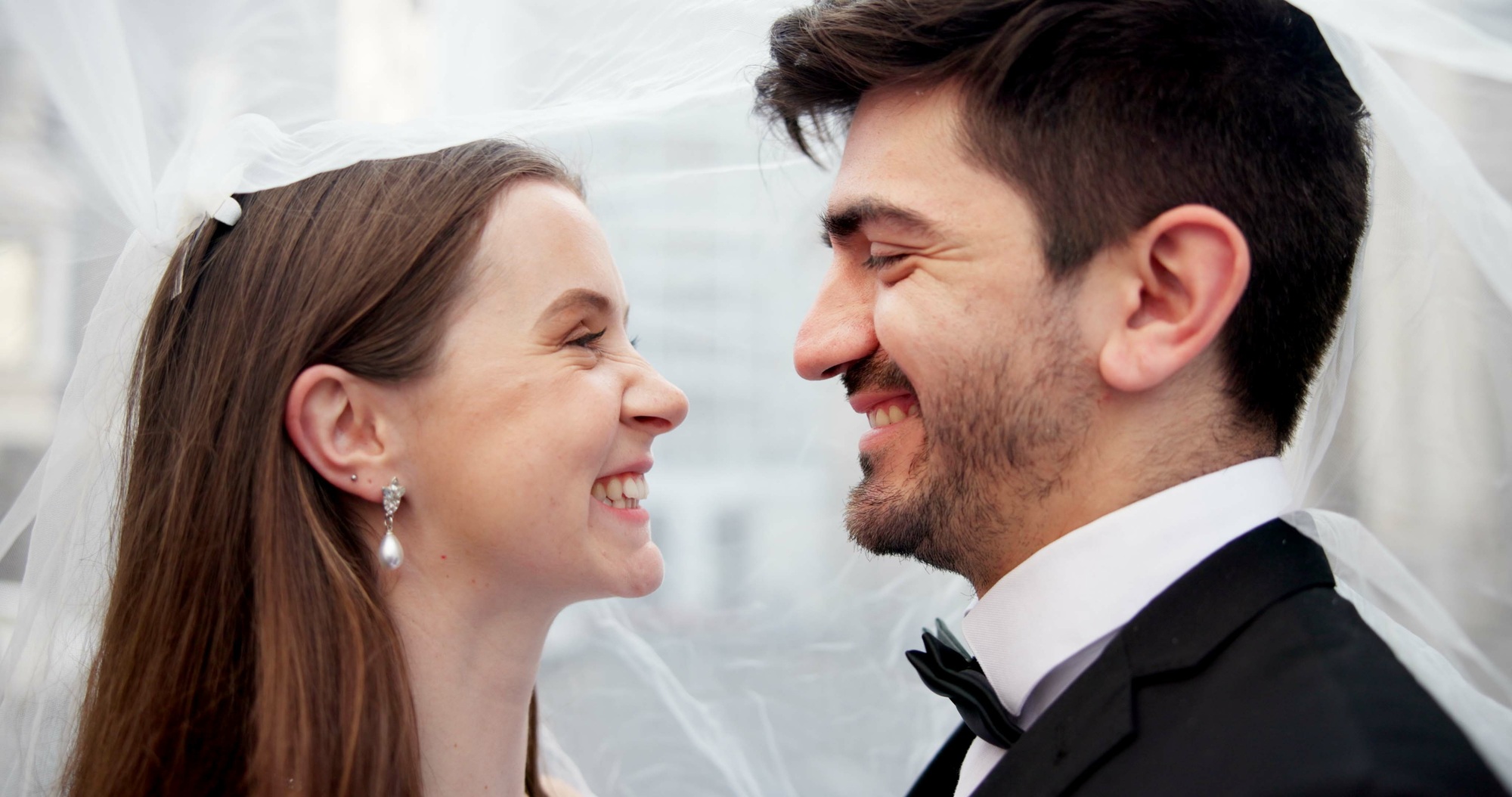 Couple, wedding and smile outdoor with veil for memory, love and event for milestone with relations