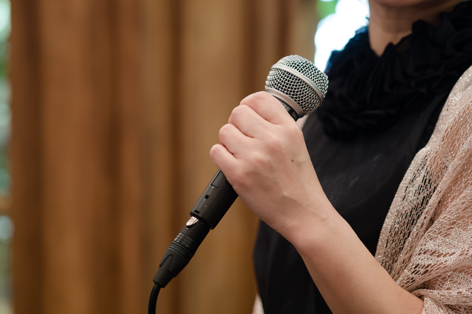 A Japanese woman speaks at an event.